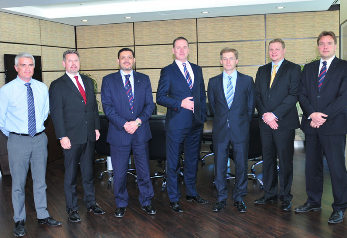 Executives from Abu Dhabi Ports and Konecranes. Executives from Abu Dhabi Ports and Konecranes.