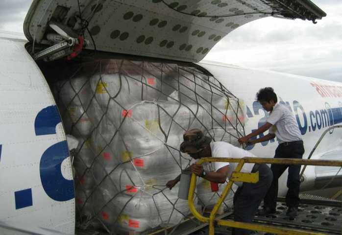 Workers unload aid from a Chapman Freeborn-chartered DC-8 in Rangoon last year. Workers unload aid from a Chapman Freeborn-chartered DC-8 in Rangoon last year.
