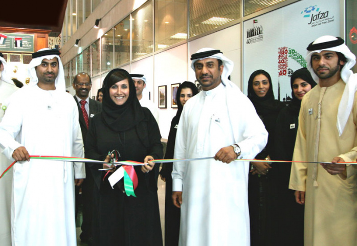 Salma Hareb, CEO, Economic Zones World, cuts the ribbon for National Day celebrations. Salma Hareb, CEO, Economic Zones World, cuts the ribbon for National Day celebrations.