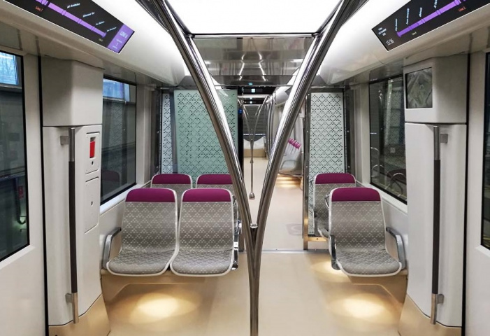 The interior of a Riyadh Metro carriage: the triangle pattern on the chairs is taken from the mud houses of Riyadh, while the vertical handrails resemble branching palm trees. The interior of a Riyadh Metro carriage: the triangle pattern on the chairs is taken from the mud houses of Riyadh, while the vertical handrails resemble branching palm trees.