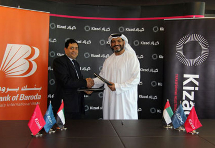 Ashok K.Gupta and Khaled Salmeen signing the agreement on behalf of Bank of Baroda and Kizad. Ashok K.Gupta and Khaled Salmeen signing the agreement on behalf of Bank of Baroda and Kizad.