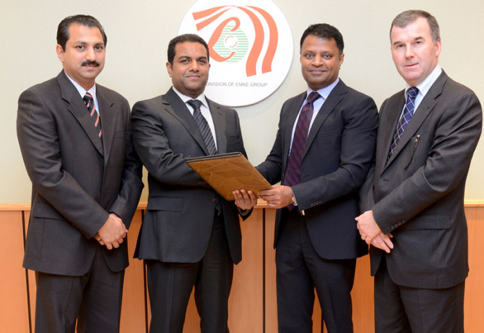 Lulu Hypermarket and Gulf Warehousing Company executives exchanging contract documents Lulu Hypermarket and Gulf Warehousing Company executives exchanging contract documents