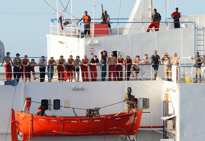Pirates surround the captive crew of the Ukrainian-registered MV Faina, which was released in February. Courtesy of AFP/Getty Pirates surround the captive crew of the Ukrainian-registered MV Faina, which was released in February. Courtesy of AFP/Getty